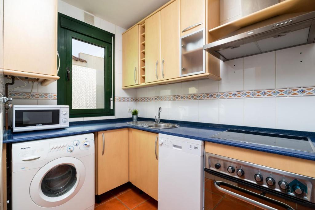 Kuchyň nebo kuchyňský kout v ubytování Duplex Aldea Del Coto