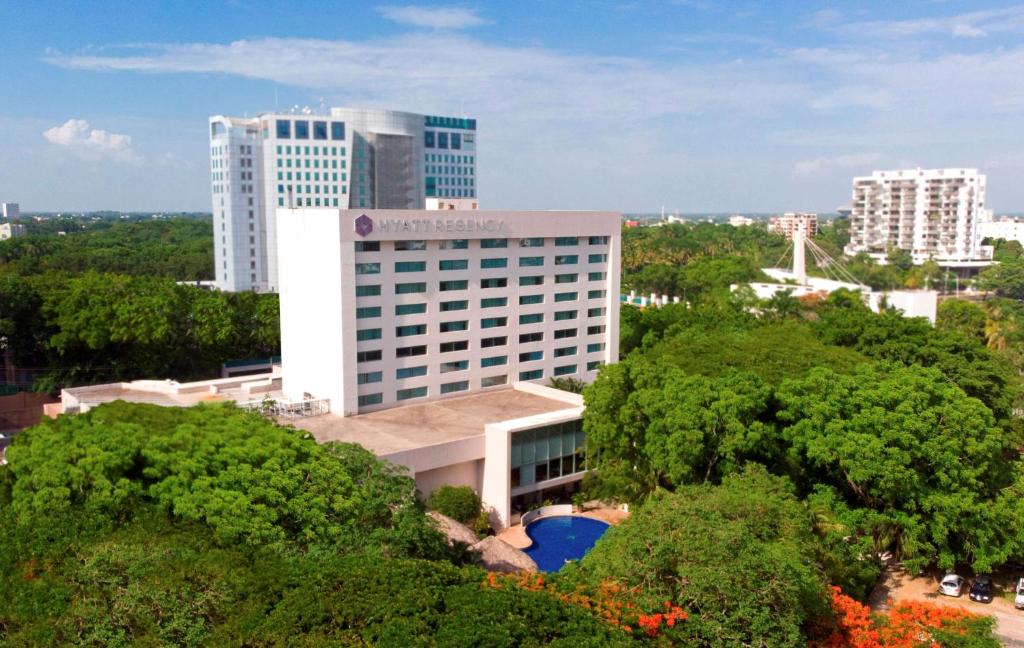 a large building with a view of the ocean at Hyatt Regency Villahermosa in Villahermosa