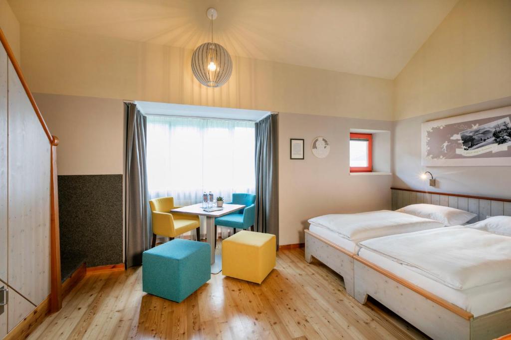 Postel nebo postele na pokoji v ubytování JUFA Hotel Eisenerzer Ramsau