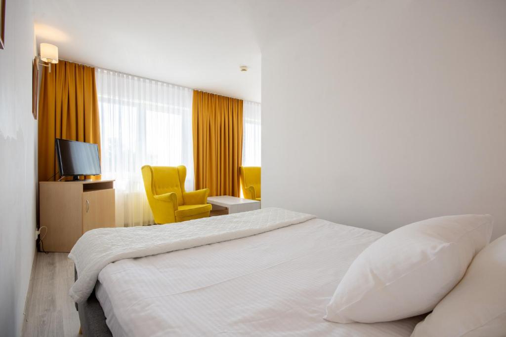 Postel nebo postele na pokoji v ubytování Hotel Jan
