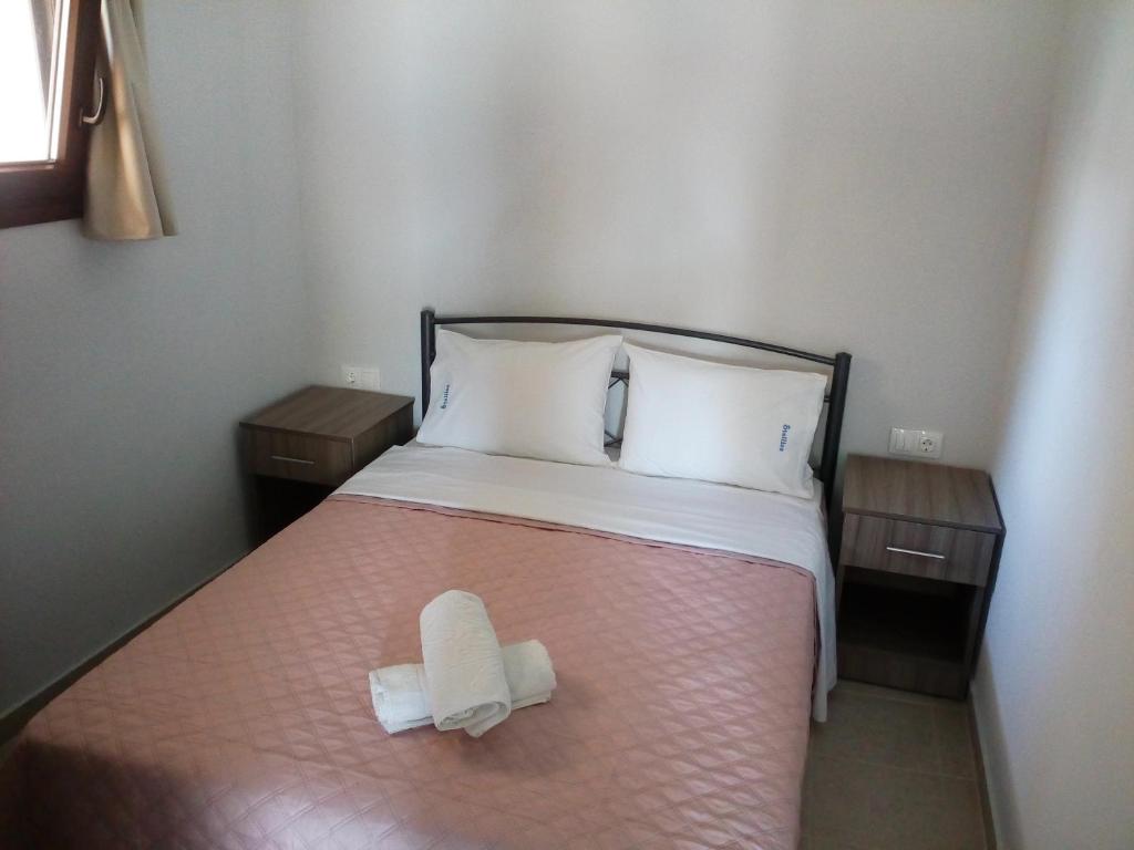Postel nebo postele na pokoji v ubytování Stelios House