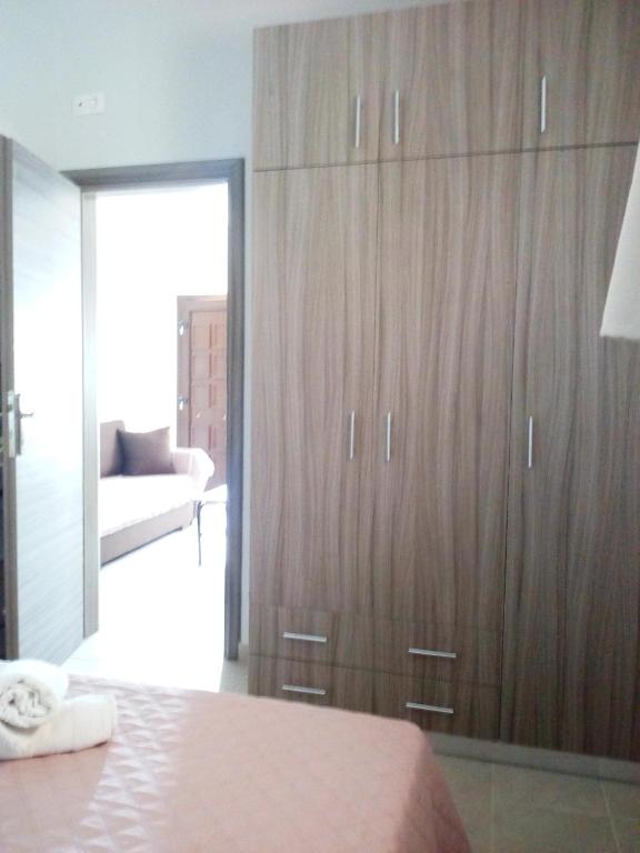 Postel nebo postele na pokoji v ubytování Stelios House