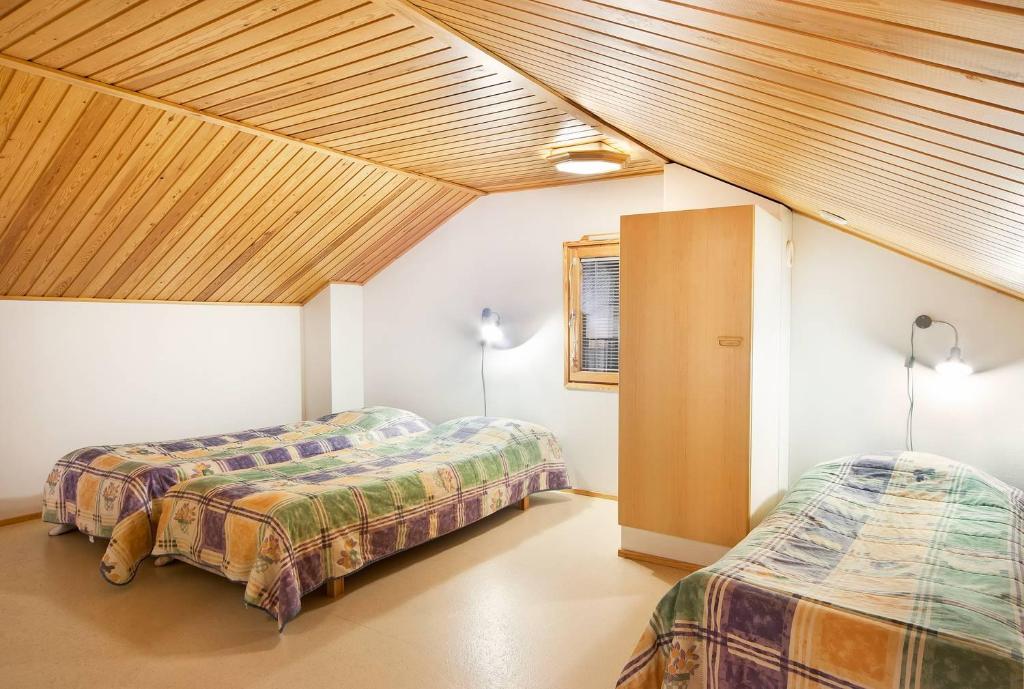 Postel nebo postele na pokoji v ubytování Holiday Club Saariselkä Apartments