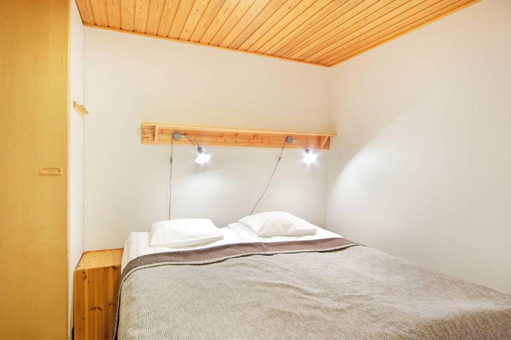 Postel nebo postele na pokoji v ubytování Holiday Club Saariselkä Apartments