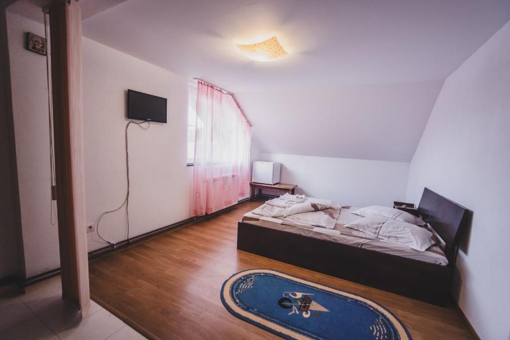 Postel nebo postele na pokoji v ubytování La Pădure Pensiune-Restaurant