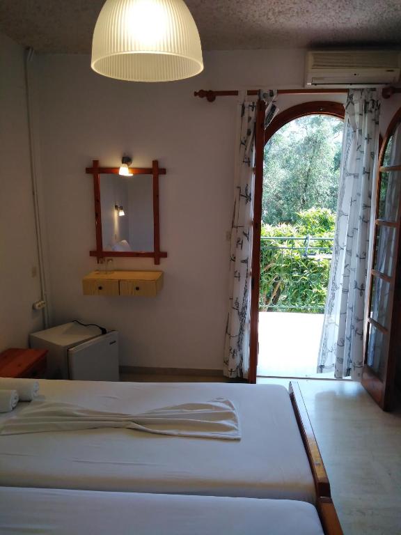 Postel nebo postele na pokoji v ubytování Ηotel Della