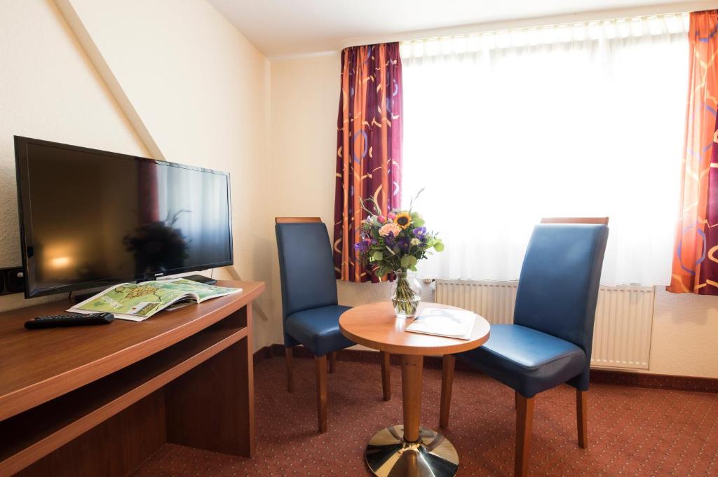 TV a/nebo společenská místnost v ubytování Hotel Traube Rüdesheim