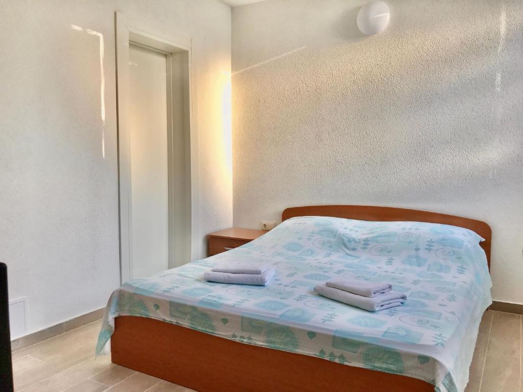 Posteľ alebo postele v izbe v ubytovaní Apartmani Ružica