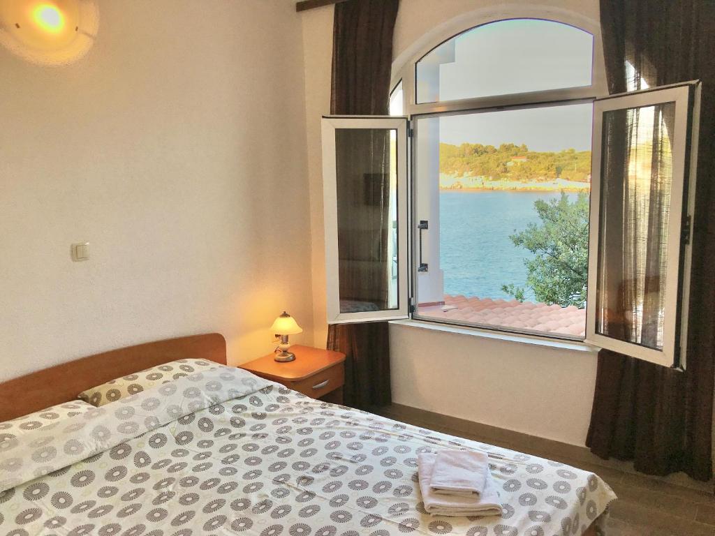 Posteľ alebo postele v izbe v ubytovaní Apartmani Ružica