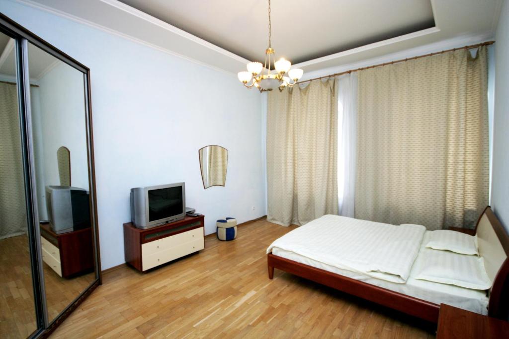 Postel nebo postele na pokoji v ubytování Real Home Apartments in Kiev Center