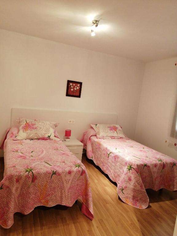 Postel nebo postele na pokoji v ubytování Auga doce