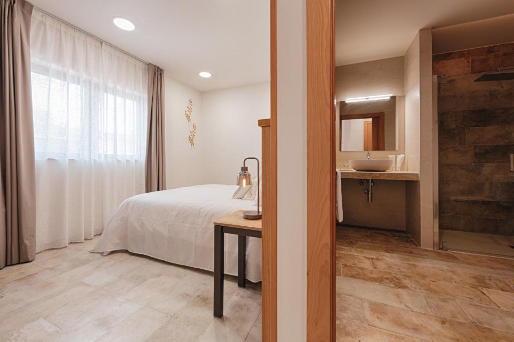 Posteľ alebo postele v izbe v ubytovaní Hotel rural La Tejera