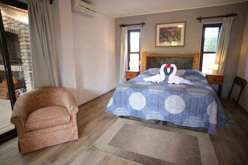 Postel nebo postele na pokoji v ubytování Resort 77