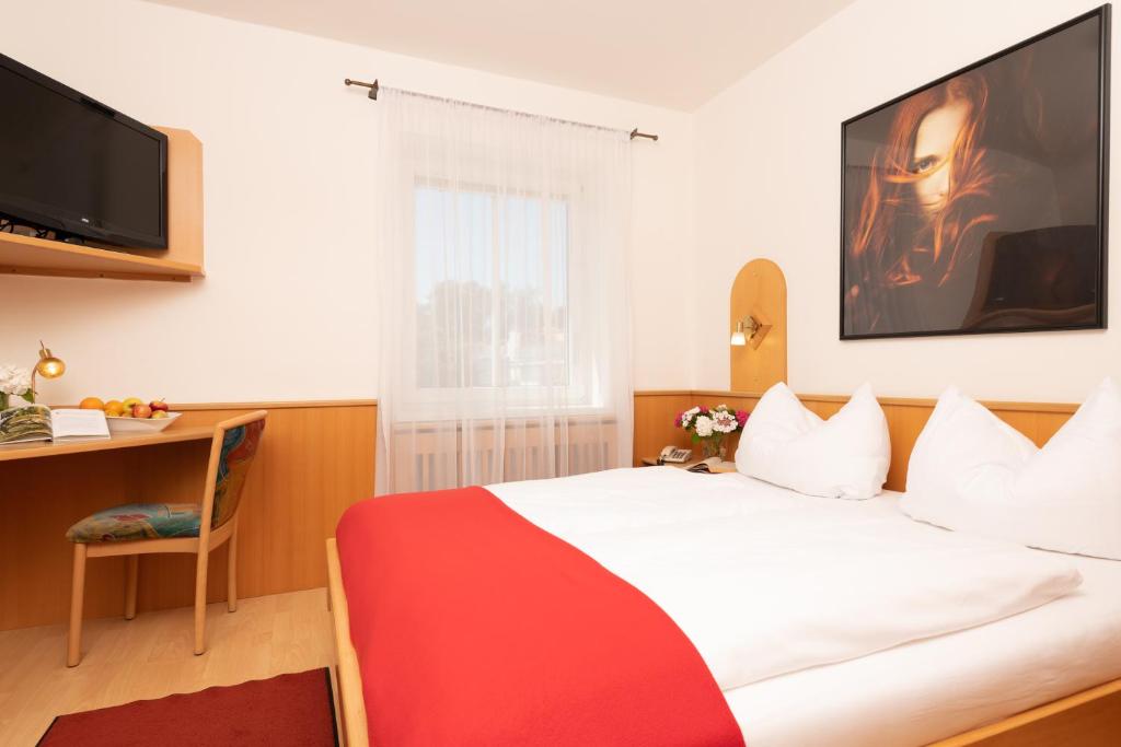 Postel nebo postele na pokoji v ubytování Hotel Liebetegger-Klagenfurt