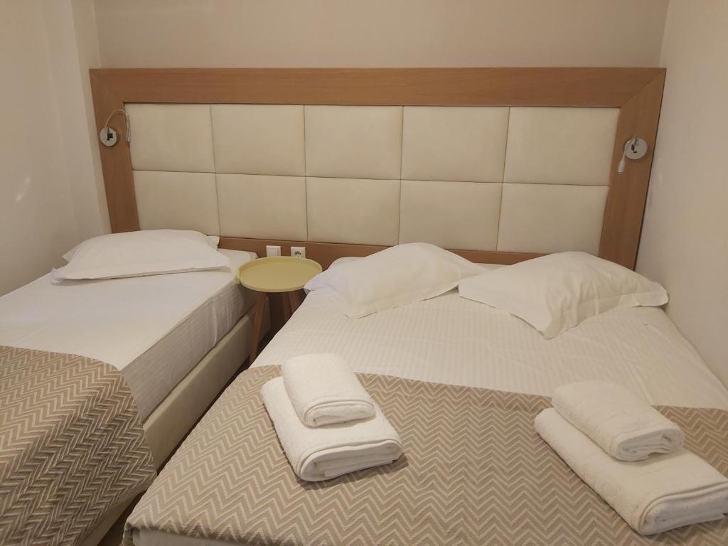 Postel nebo postele na pokoji v ubytování Villa Roussa City Center