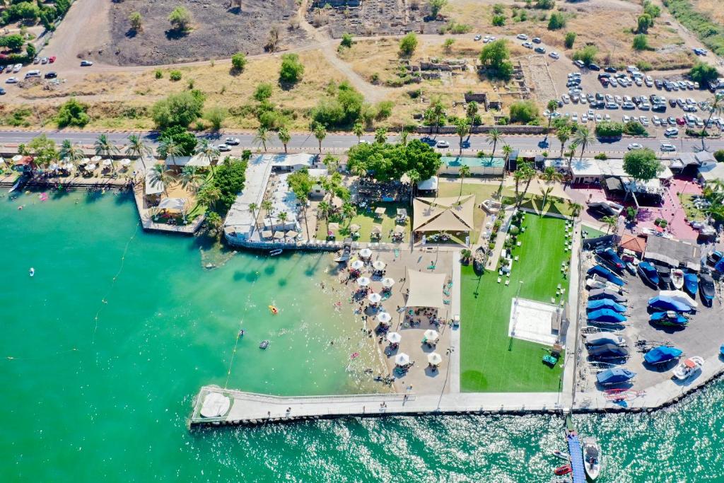 an aerial view of a park in the water at South Beach Kinnereth in Tiberias