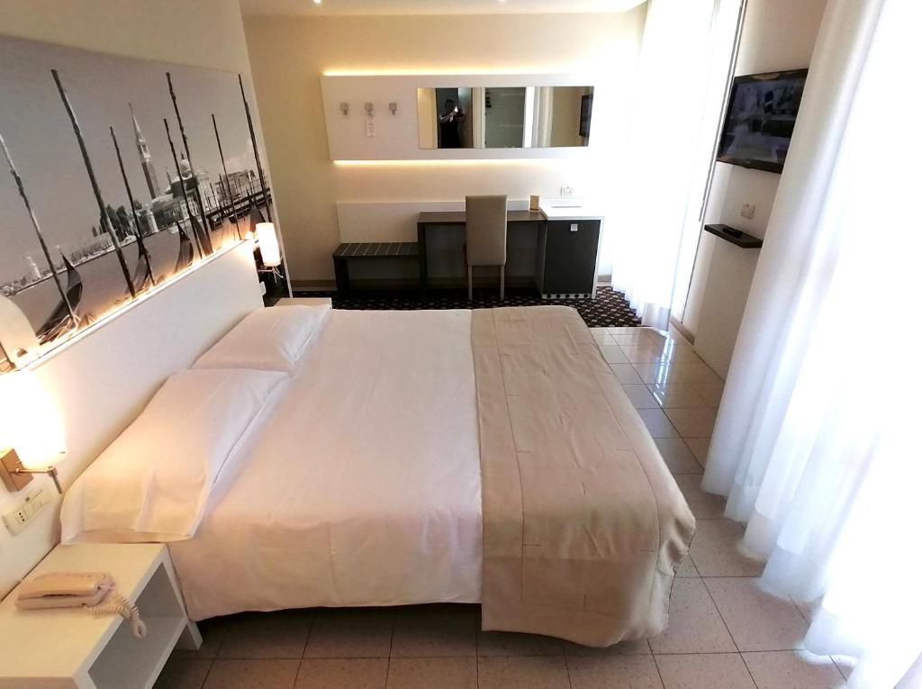 Postel nebo postele na pokoji v ubytování Palace Hotel Regina