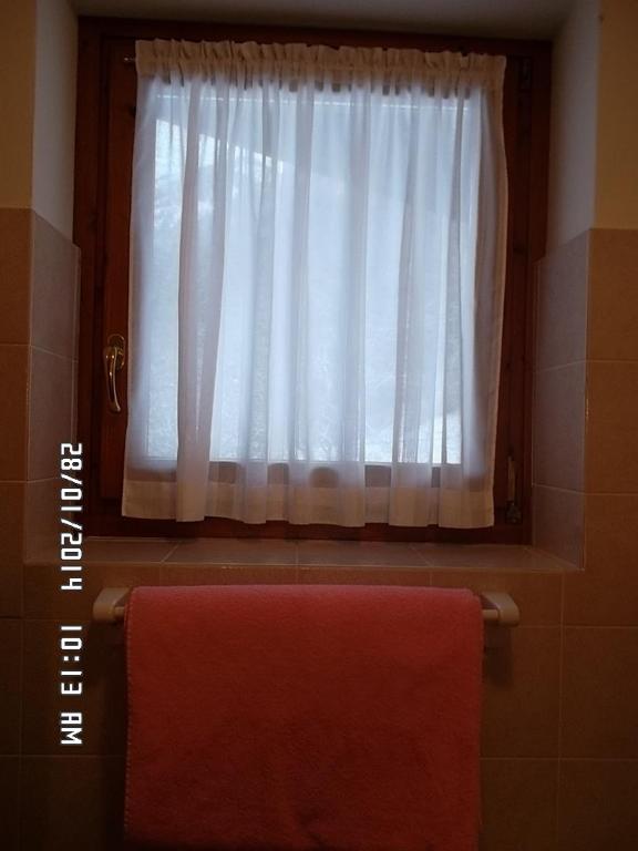 Postel nebo postele na pokoji v ubytování Hotel Residence La Rosa