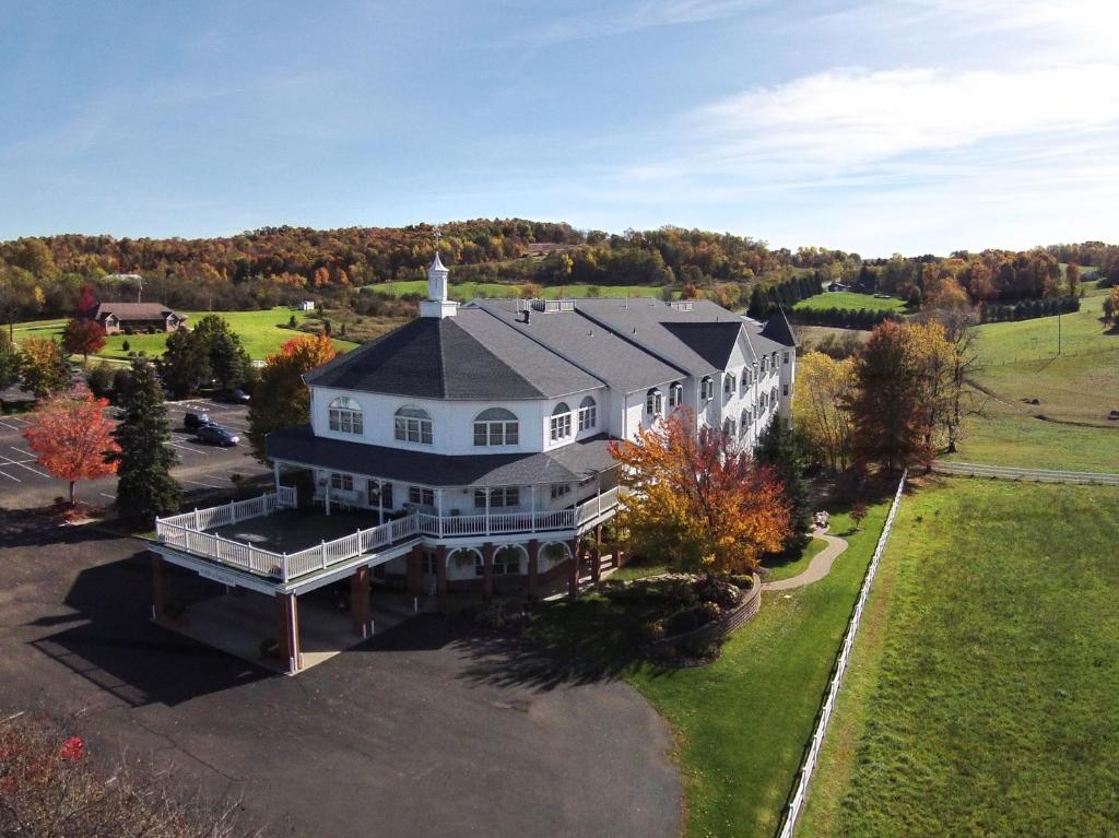 an aerial view of a large white house at Inn at Amish Door in Wilmot