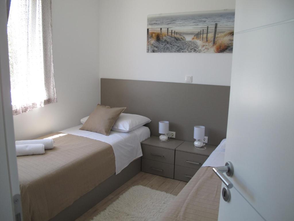 Postel nebo postele na pokoji v ubytování Apartments Mia Krk