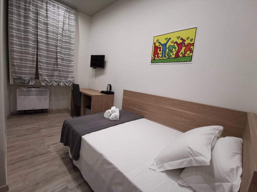 Postel nebo postele na pokoji v ubytování A&B Affittacamere a Boccadasse