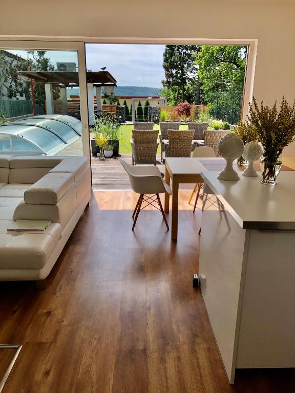a living room with a couch and a table at Vila Martina in Popůvky