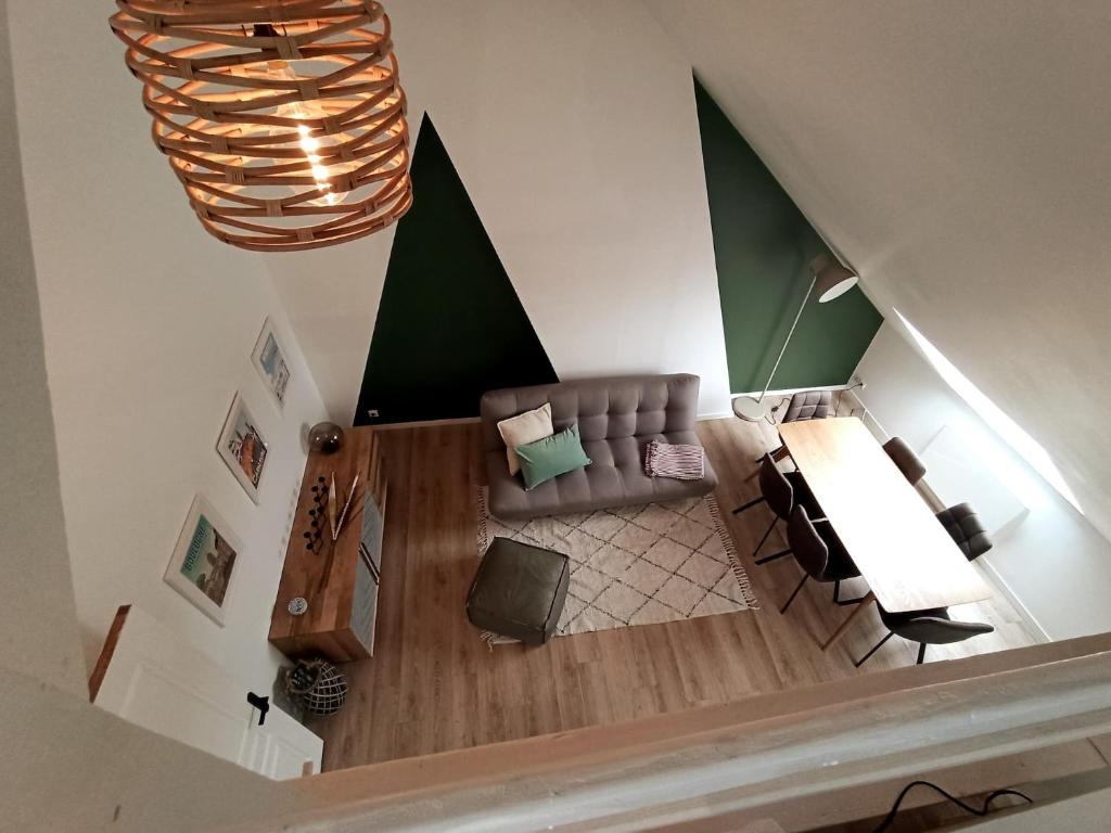 an overhead view of a living room with a couch at Les Hauts des Caps in Boulogne-sur-Mer
