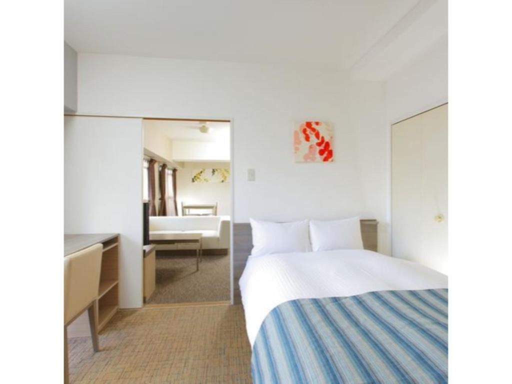 Ein Bett oder Betten in einem Zimmer der Unterkunft HOTEL MYSTAYS Otemae - Vacation STAY 87098
