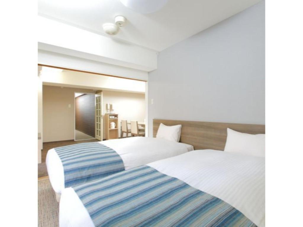 Ein Bett oder Betten in einem Zimmer der Unterkunft HOTEL MYSTAYS Otemae - Vacation STAY 87133