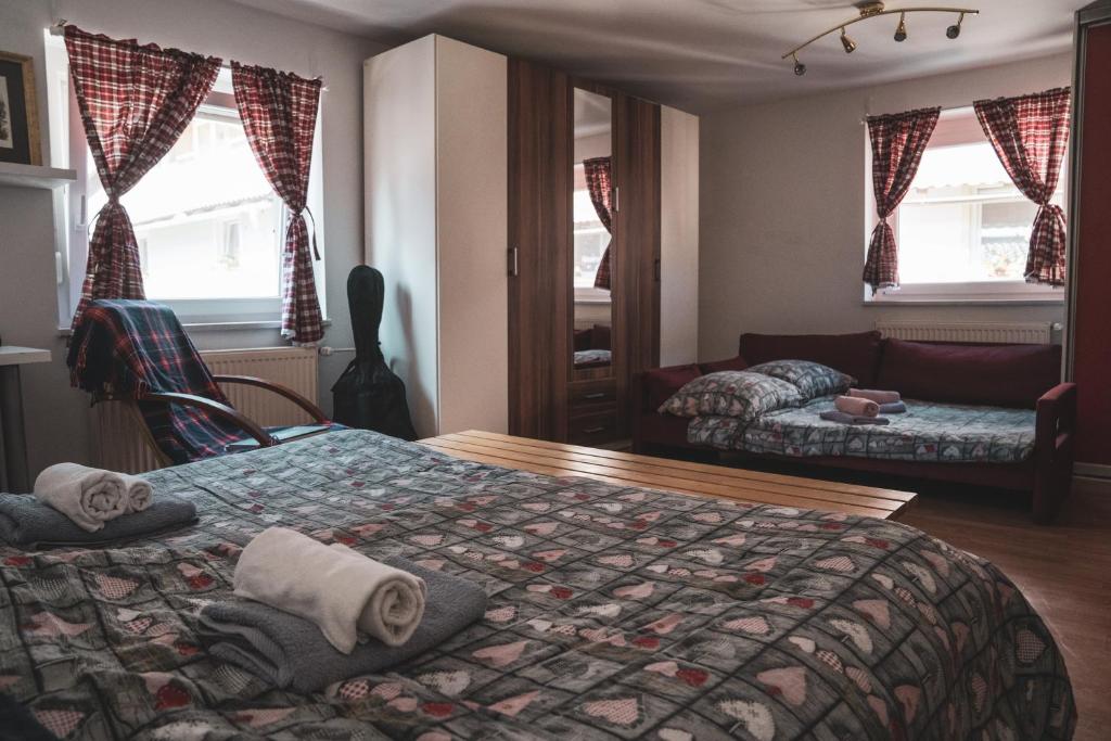 Postel nebo postele na pokoji v ubytování Učni ranč, Bohinj