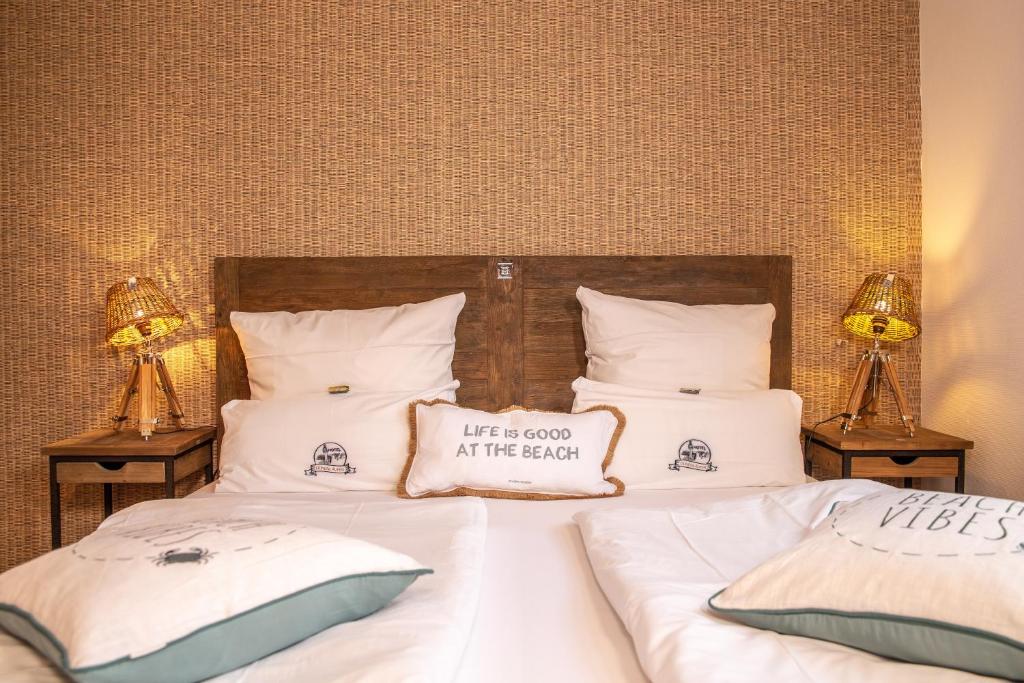 Voodi või voodid majutusasutuse HOTEL DÜNENLÄUFER Langeoog toas