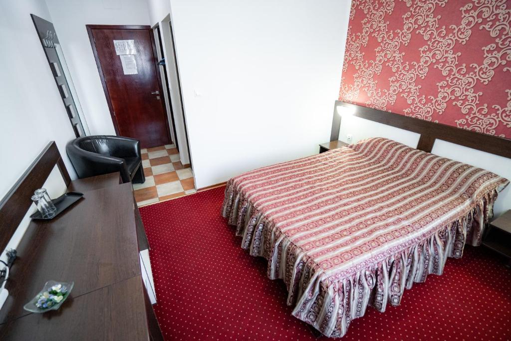 Postel nebo postele na pokoji v ubytování Hotel Polaris
