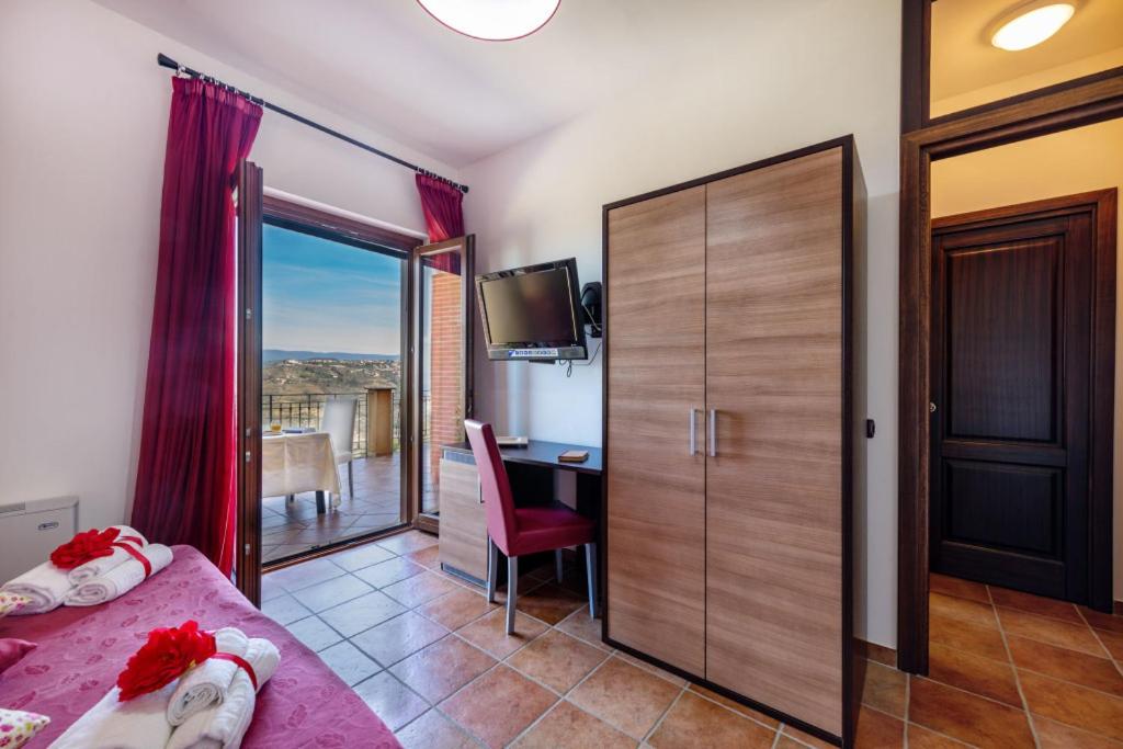 Łóżko lub łóżka w pokoju w obiekcie Casa Vacanza Villa Aurora
