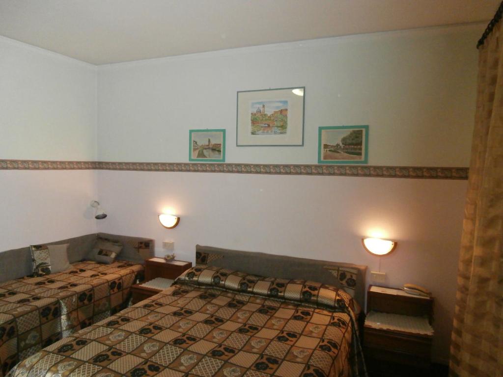 Postel nebo postele na pokoji v ubytování Albergo Junior