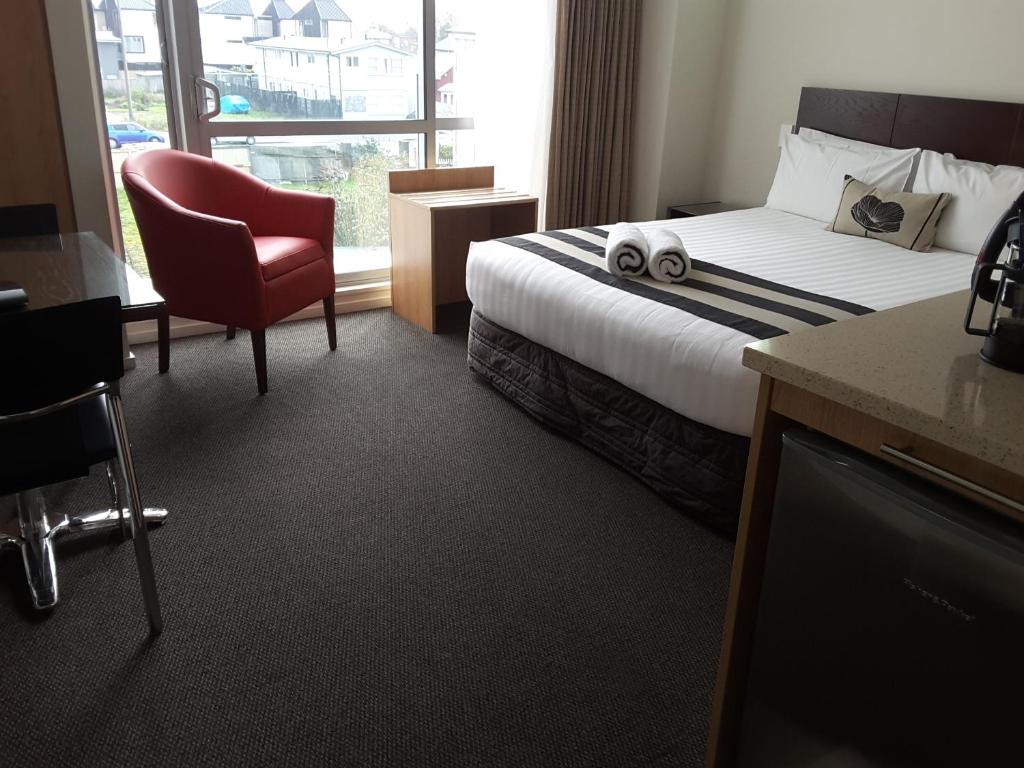 Postel nebo postele na pokoji v ubytování Focus Motel