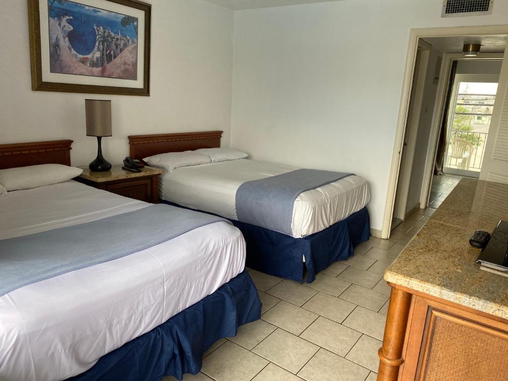 Postel nebo postele na pokoji v ubytování Brittany Motel