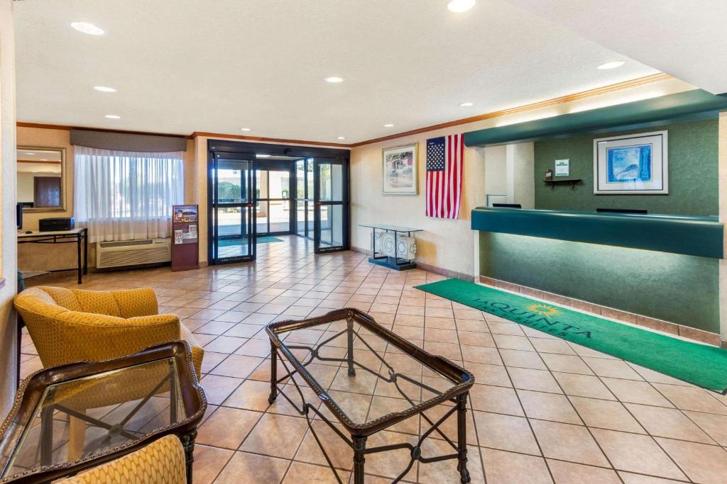 a large lobby with a pool table and chairs at La Quinta Inn & Suites by Wyndham Las Cruces Organ Mountain in Las Cruces