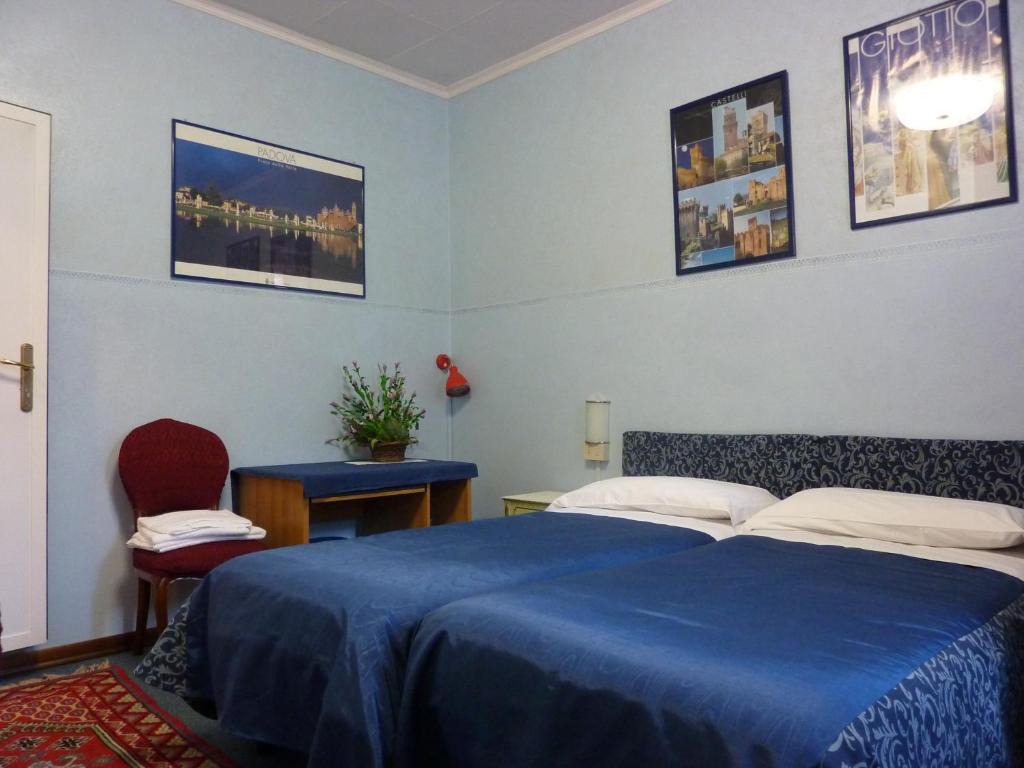 Postel nebo postele na pokoji v ubytování Albergo Junior