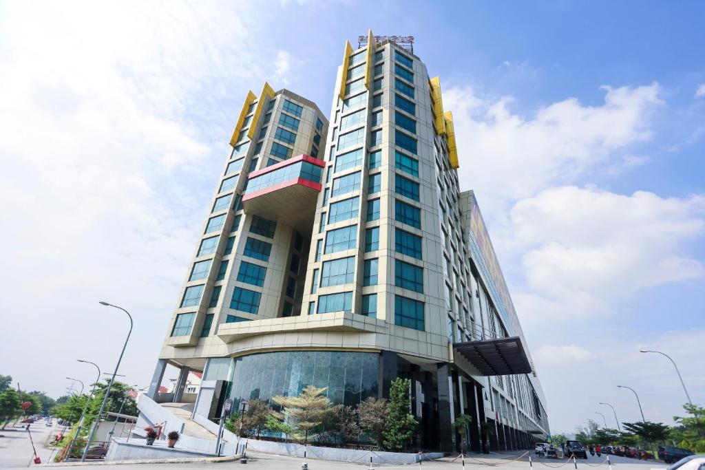 a tall building with a lot of windows at Pegasus Hotel Shah Alam in Shah Alam