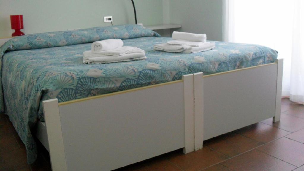 Postel nebo postele na pokoji v ubytování Albergo Residence Isotta