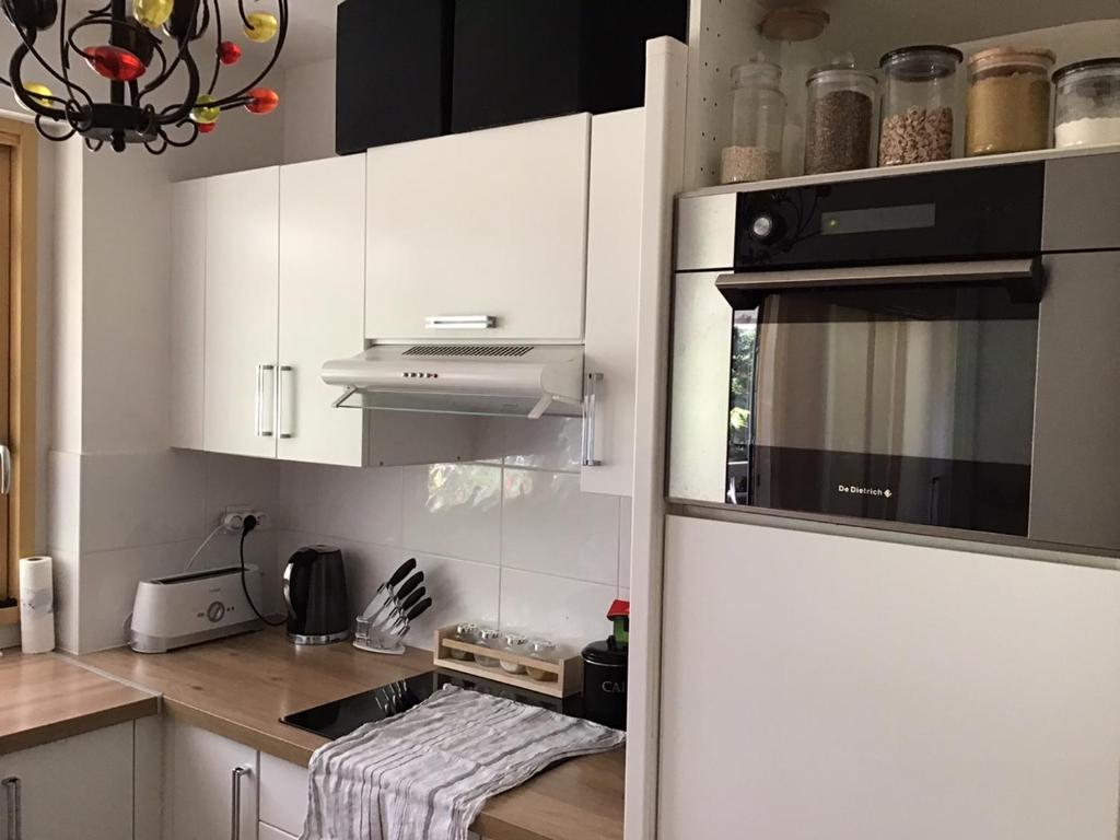 A kitchen or kitchenette at Appartement Monseigneur