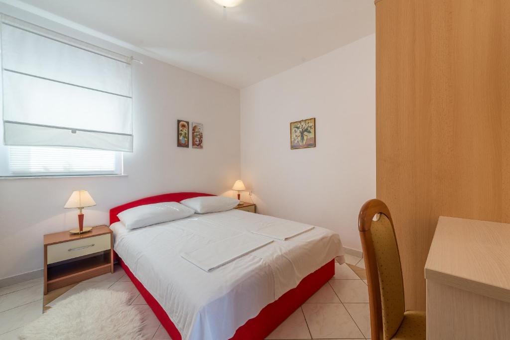 Posteľ alebo postele v izbe v ubytovaní Lavanda Apartment