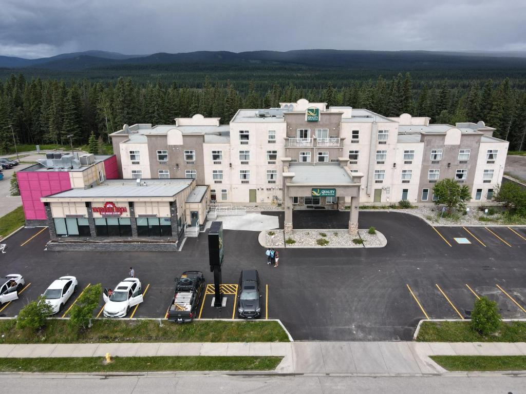 an aerial view of a hotel with cars parked in a parking lot at Quality Inn & Suites in Hinton