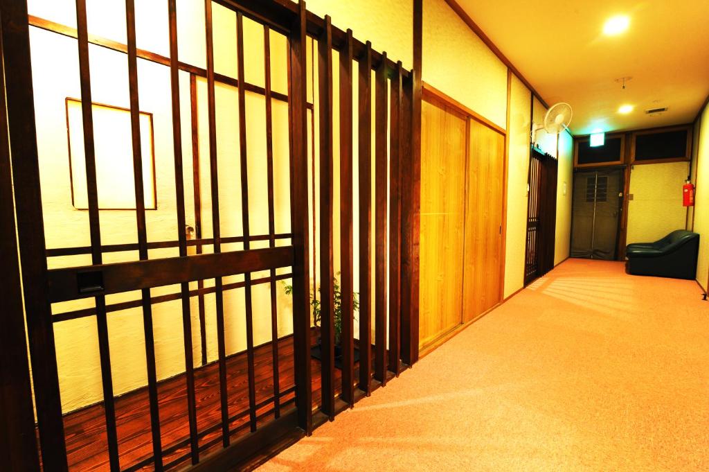 Postel nebo postele na pokoji v ubytování Onsen Yado Misuzuso