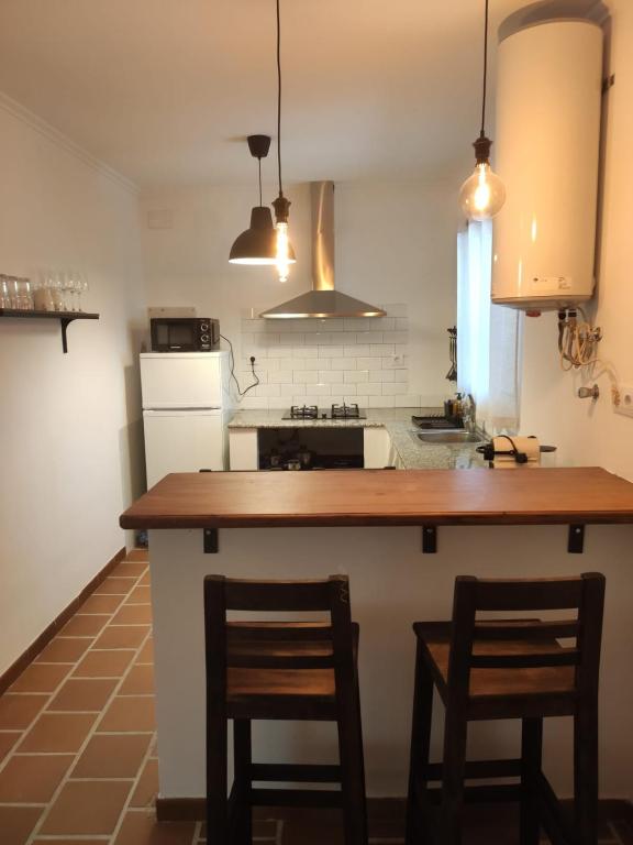 Kuchyň nebo kuchyňský kout v ubytování CASA RURAL CORTIJO LAS HUERTAS