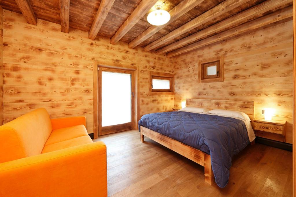 Letto o letti in una camera di Albergo Diffuso Sutrio Zoncolan