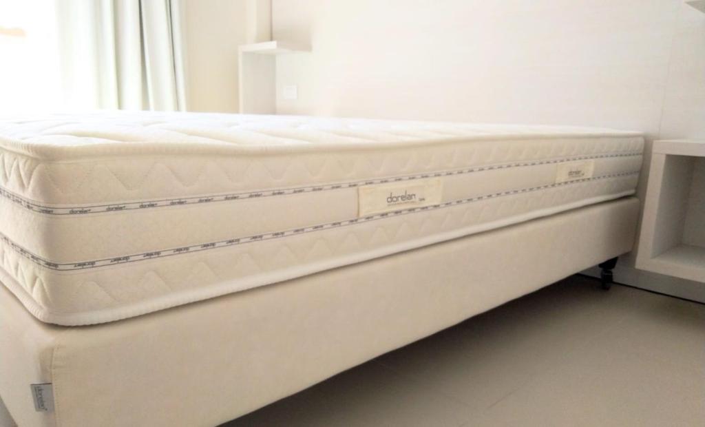 A bed or beds in a room at Hotel Carducci