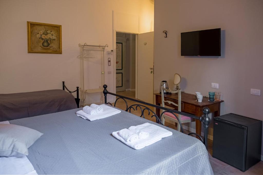Postel nebo postele na pokoji v ubytování Città Di Castello Rooms