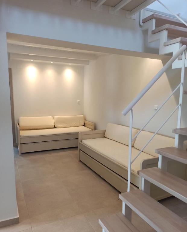 Łóżko lub łóżka w pokoju w obiekcie Aliki Boutique Hotel