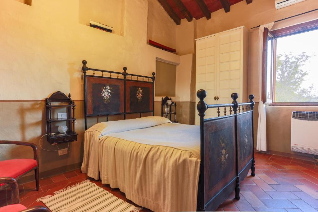 Postel nebo postele na pokoji v ubytování AGRITURISMO LE CORTI DELLA GUALDANA